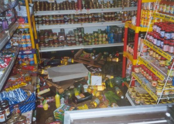 A flooded retail outlet with foodstuffs